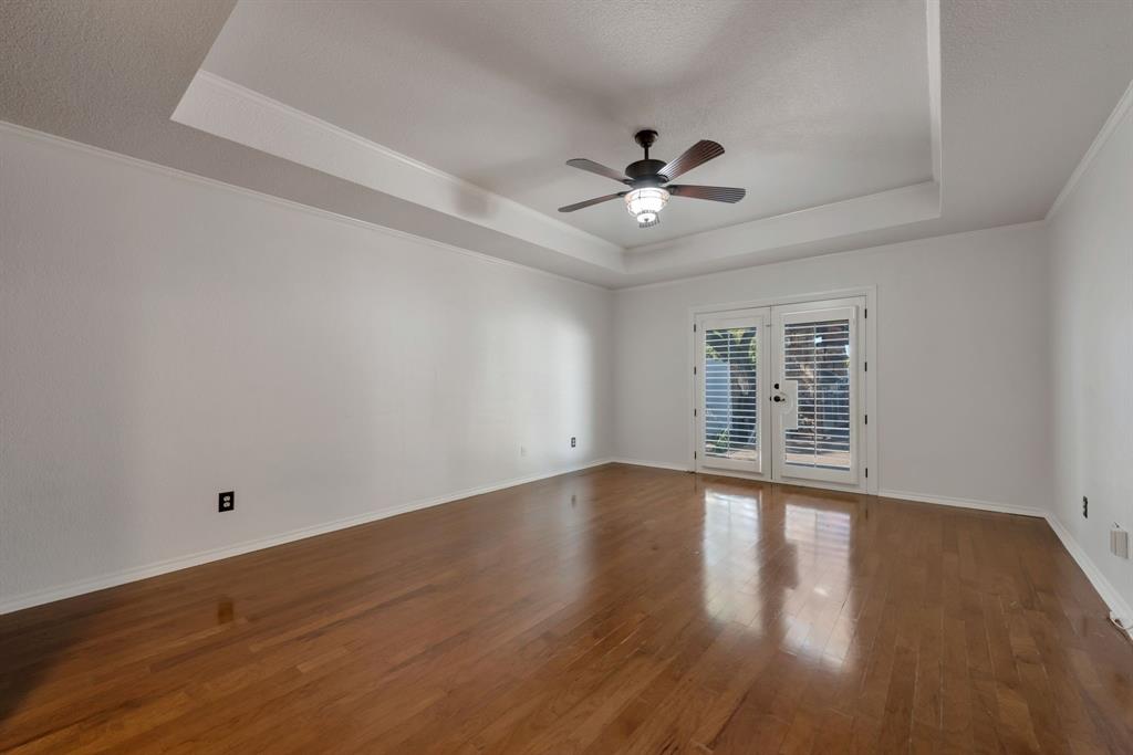 3305 Timber View Circle Bedford, TX 76021 - Photo 17 of 26 a view of an empty room with wooden floor and a window