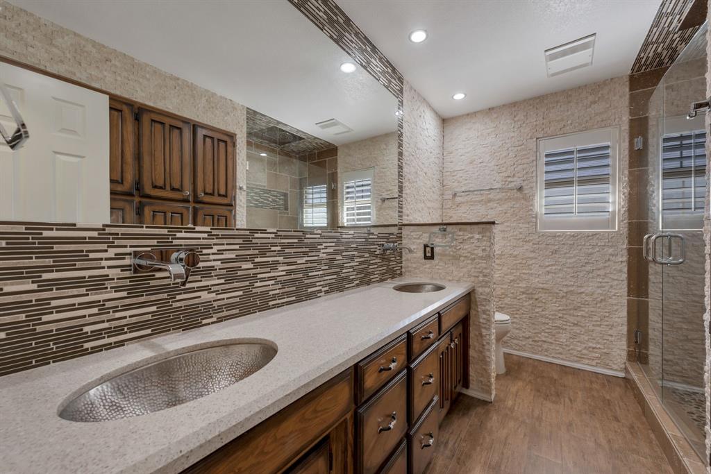 3305 Timber View Circle Bedford, TX 76021 - Photo 19 of 26 a kitchen with stainless steel appliances granite countertop a sink stove and cabinets