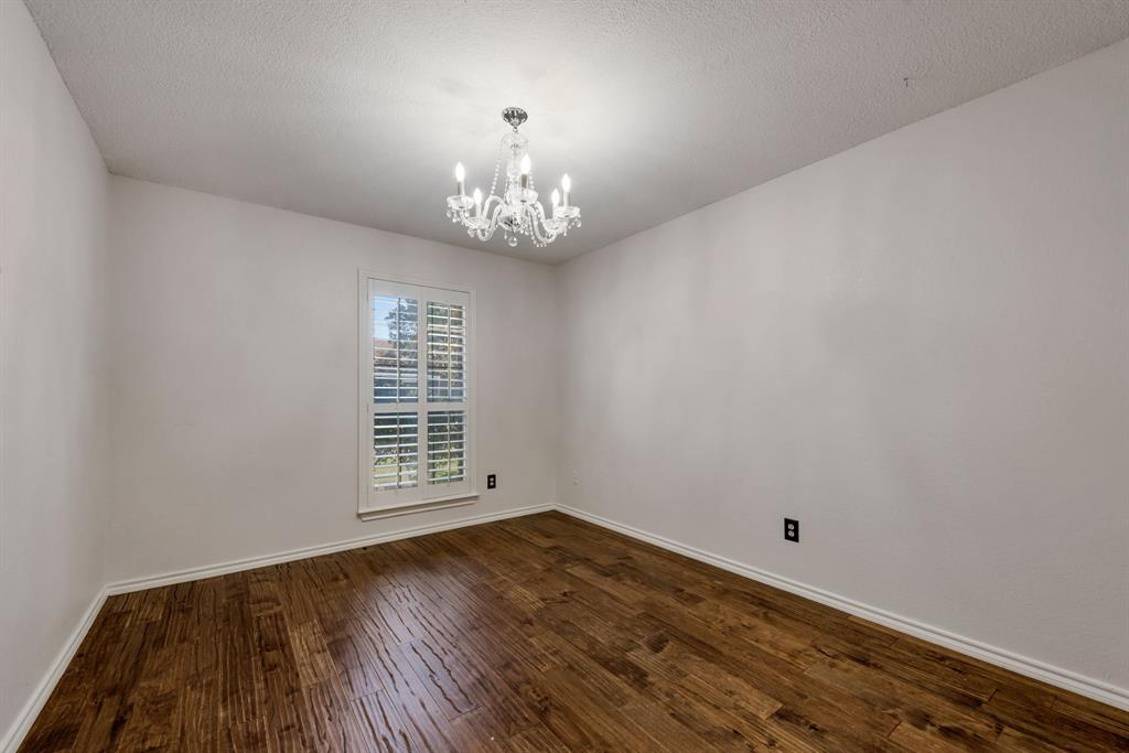 3305 Timber View Circle Bedford, TX 76021 - Photo 20 of 26 a view of a livingroom with wooden floor and a large window