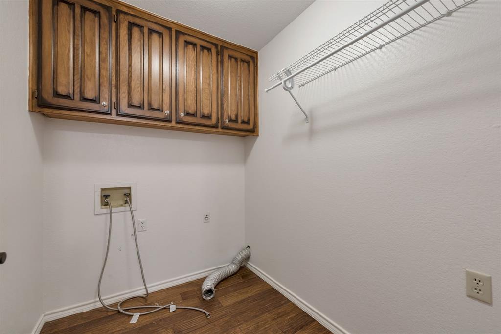 3305 Timber View Circle Bedford, TX 76021 - Photo 22 of 26 a room with water heater and cabinets