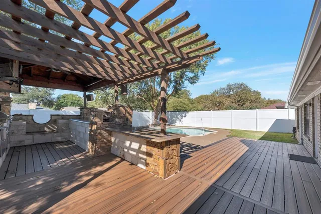 a view of swimming pool with sitting area