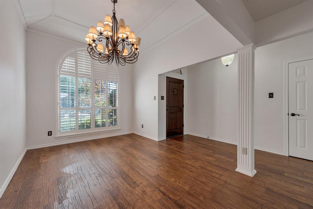 3305 Timber View Circle Bedford, TX 76021 - Photo 8 of 26 a view of an empty room with wooden floor and a window