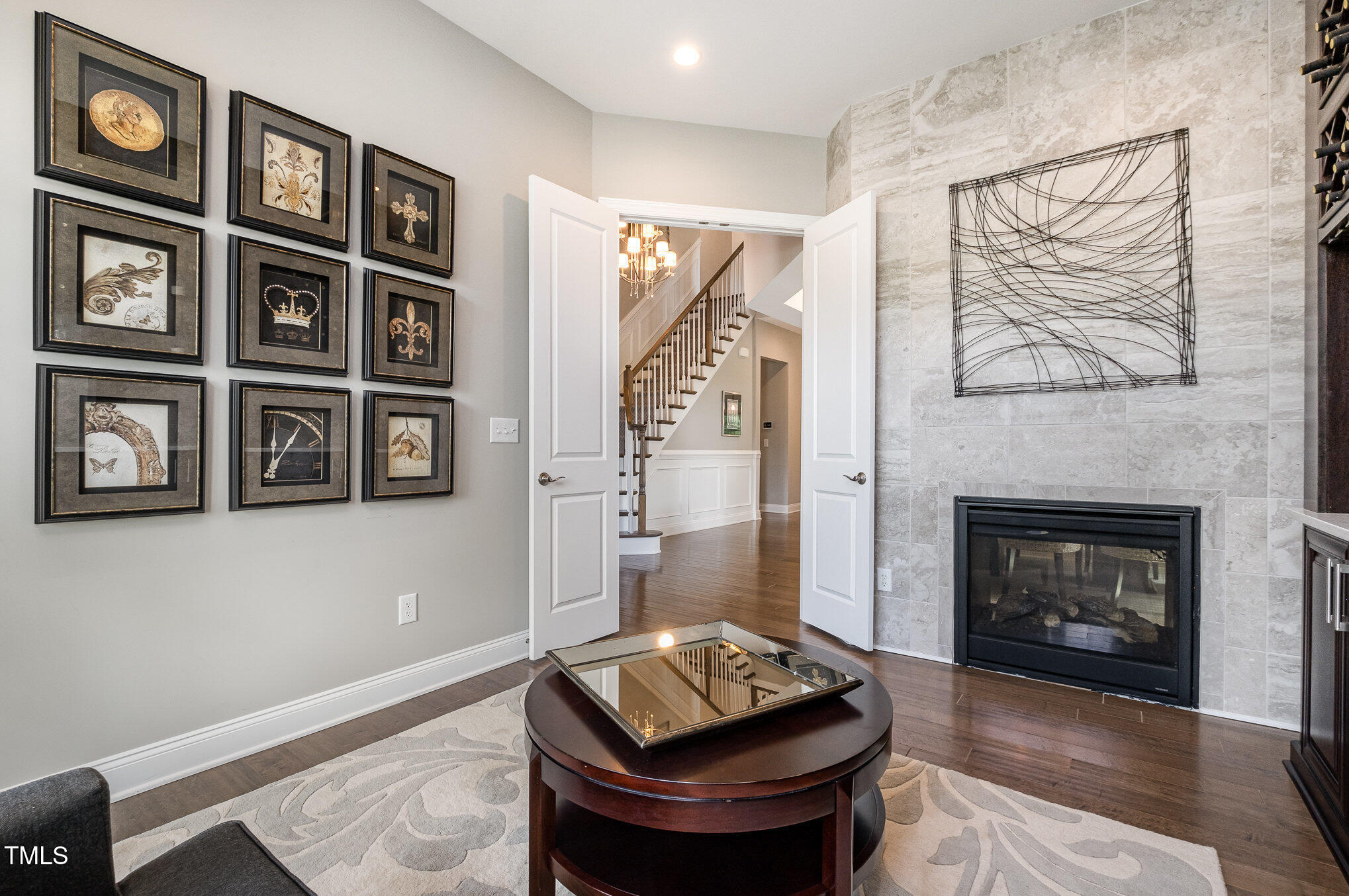 2421 Beckwith Road Apex, NC 27523 - Photo 11 of 45 Den with double sided fireplace