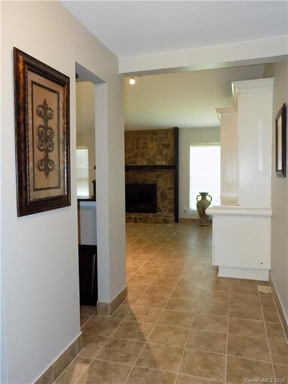 10117 Fairway Ridge Road Charlotte, NC 28277 - Photo 3 of 29 a view of a livingroom with an empty space and a fireplace
