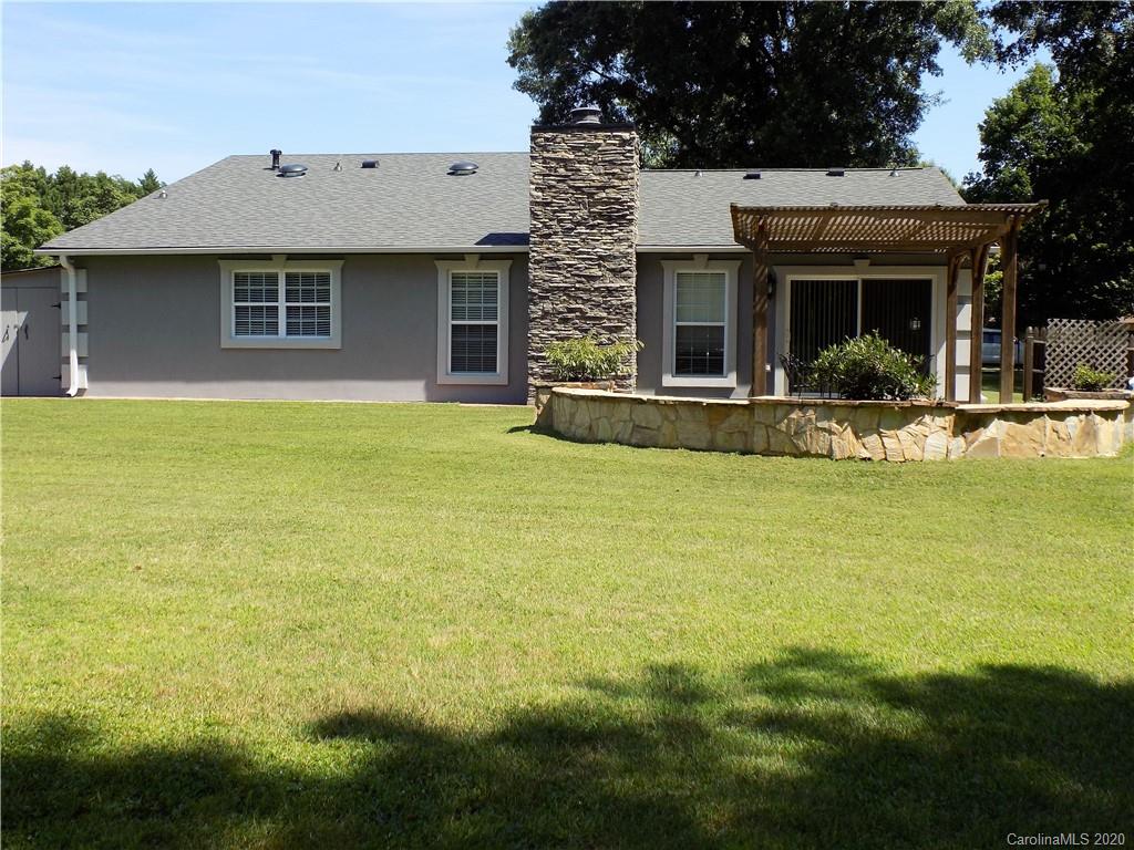 10117 Fairway Ridge Road Charlotte, NC 28277 - Photo 22 of 29 a front view of a house with swimming pool and porch with furniture