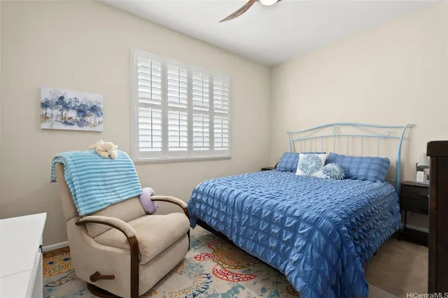 a bedroom with bed and window