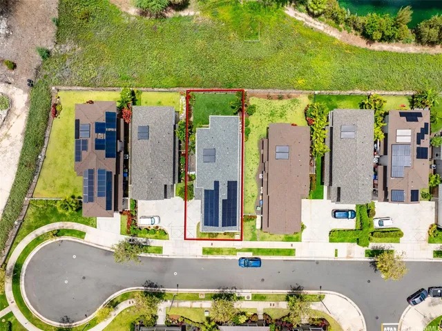 aerial view of a house with a swimming pool and outdoor seating
