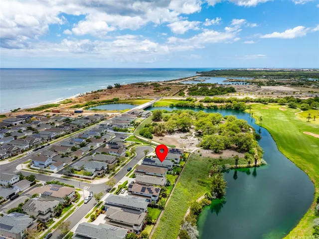 an aerial view of residential building and lake