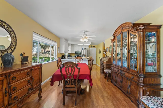 a kitchen with stainless steel appliances granite countertop a sink and a refrigerator
