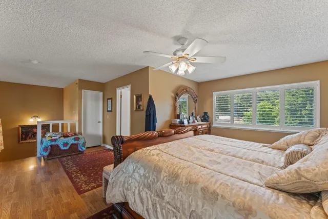 a view of a balcony with wooden floor