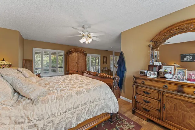 a front view of a house with swimming pool and porch