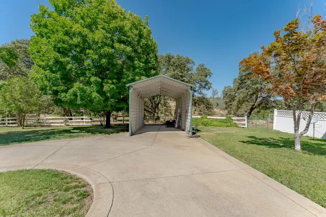 an aerial view of residential houses with city view