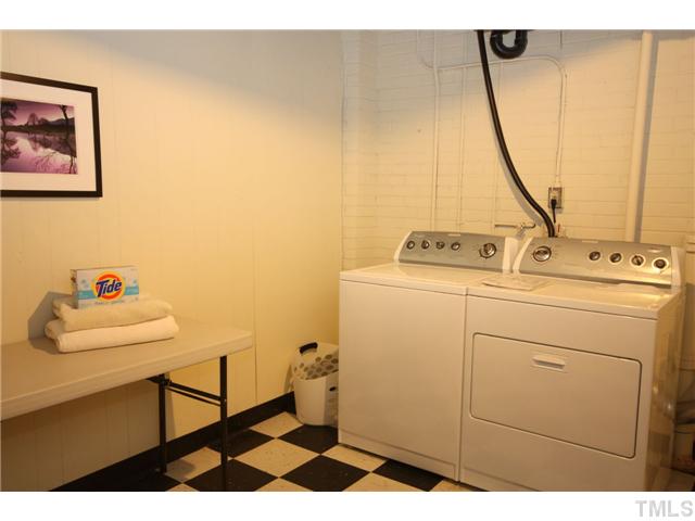 705 Brighton Road Durham, NC 27707 - Photo 11 of 24 There is a large area for a washing machine and dryer.