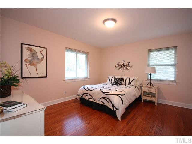 705 Brighton Road Durham, NC 27707 - Photo 7 of 24 The master bedroom has a hardwood floor, lots of natural light, and a full bathroom (with tile shower).