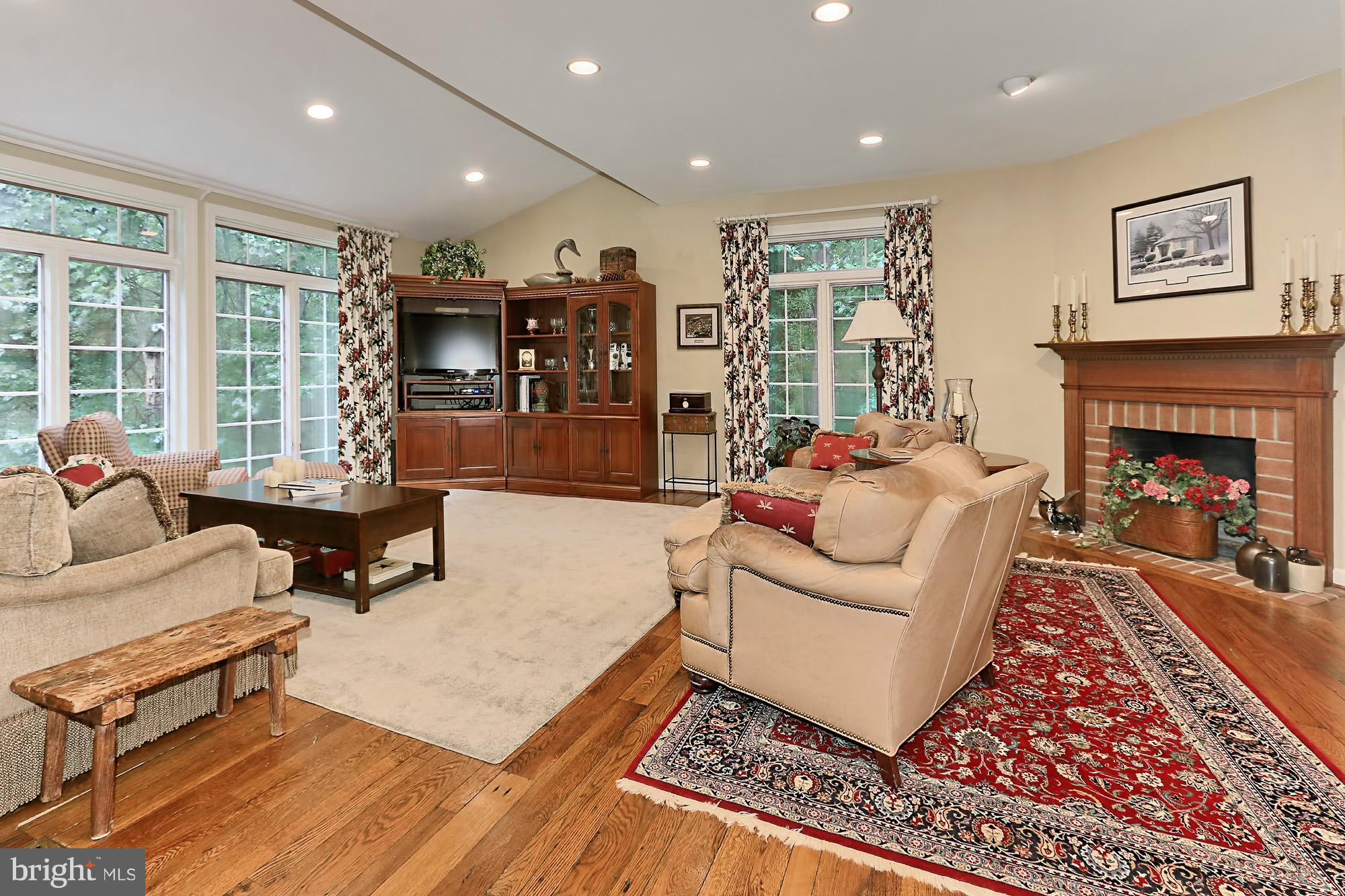 6729 Surbiton Drive Clifton, VA 20124 - Photo 3 of 25 a living room with furniture and a fireplace