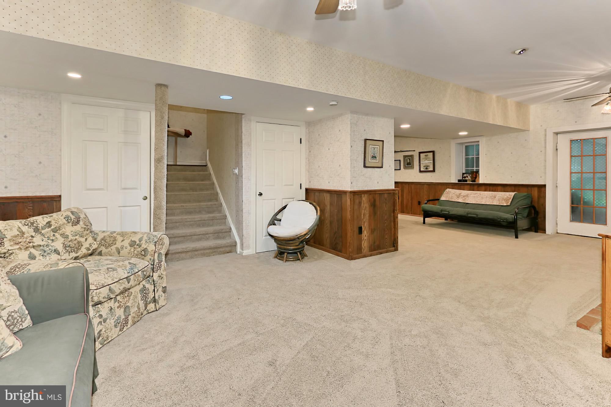 6729 Surbiton Drive Clifton, VA 20124 - Photo 21 of 25 a living room with furniture and a flat screen tv