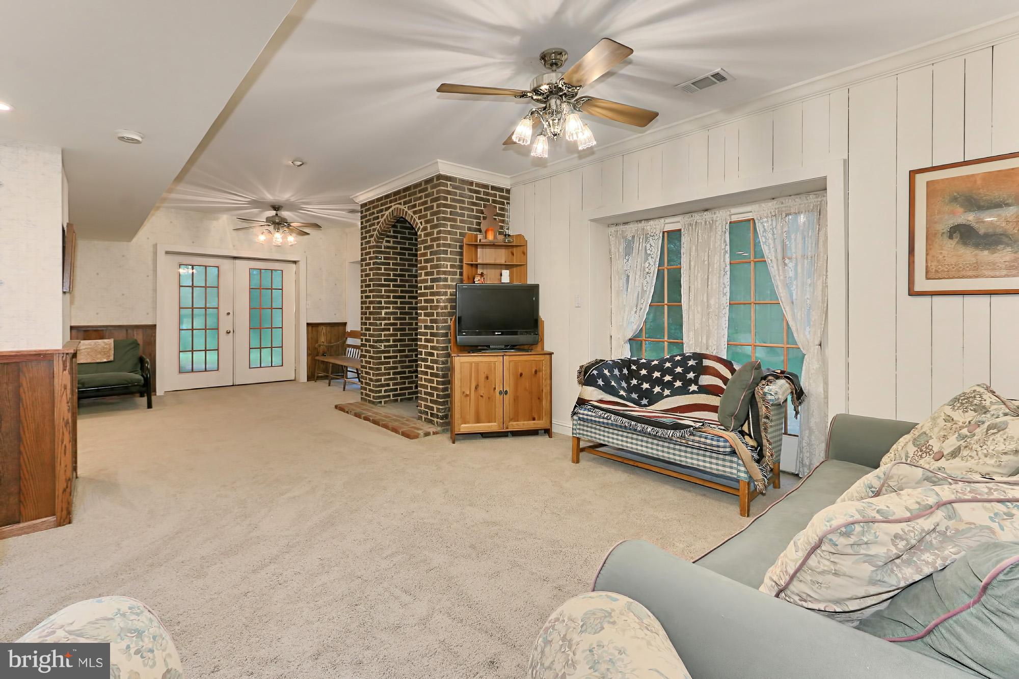 6729 Surbiton Drive Clifton, VA 20124 - Photo 22 of 25 a bedroom with furniture and a chandelier