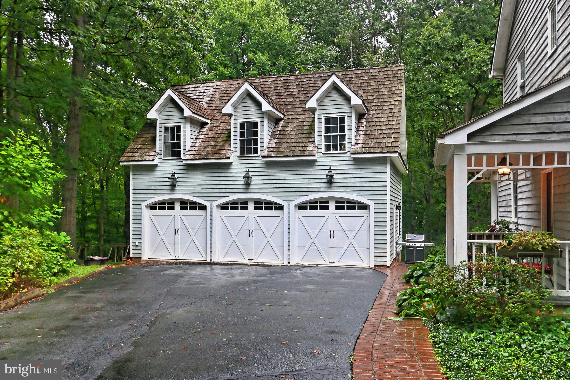 6729 Surbiton Drive Clifton, VA 20124 - Photo 24 of 25 a view of a house with a yard and garage