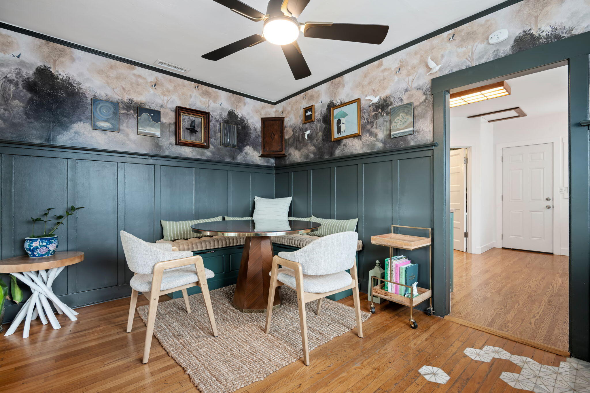802 Olive Street Santa Barbara, CA 93101 - Photo 12 of 26 a view of a dining room with furniture and wooden floor