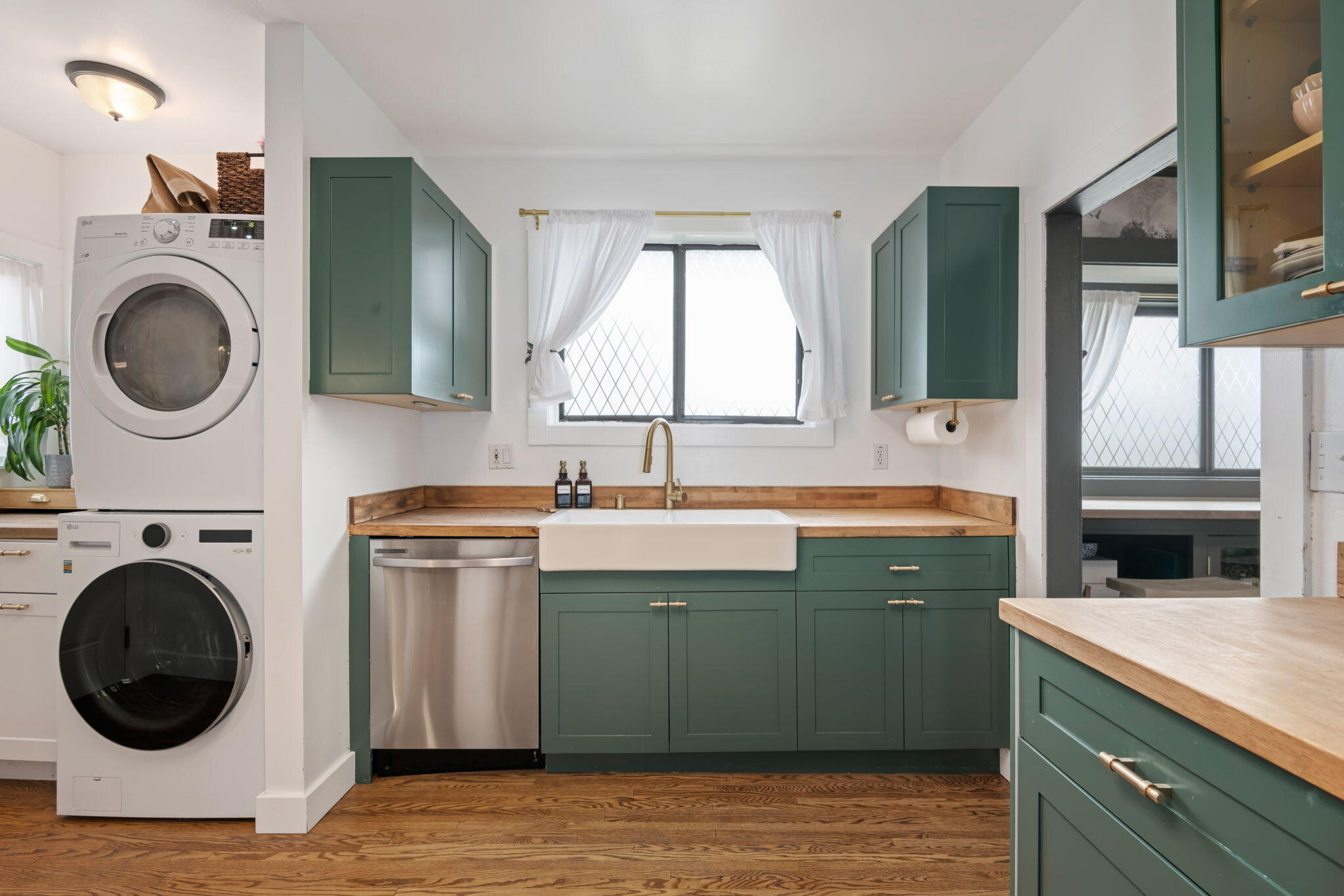 802 Olive Street Santa Barbara, CA 93101 - Photo 13 of 26 a view of a kitchen with sink washer and dryer