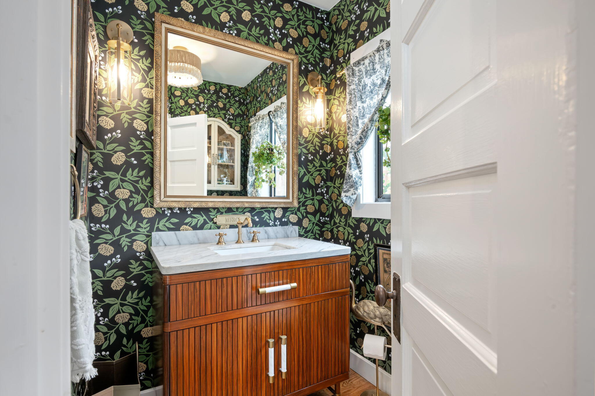 802 Olive Street Santa Barbara, CA 93101 - Photo 19 of 26 a bathroom with a sink and a mirror