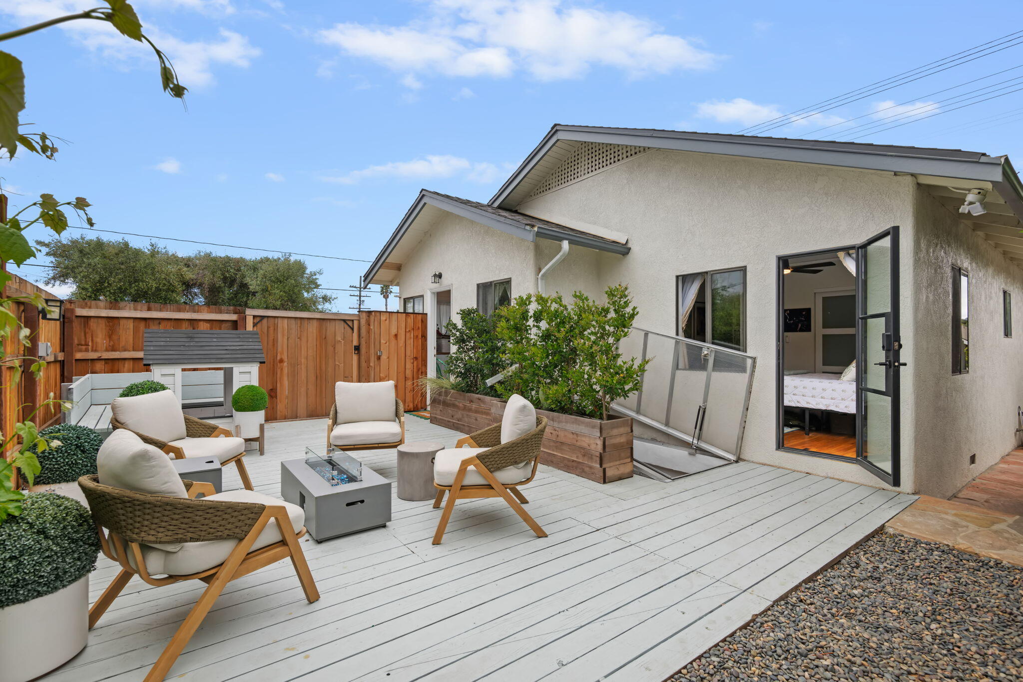 802 Olive Street Santa Barbara, CA 93101 - Photo 21 of 26 a view of a patio with table and chairs with wooden floor and fence
