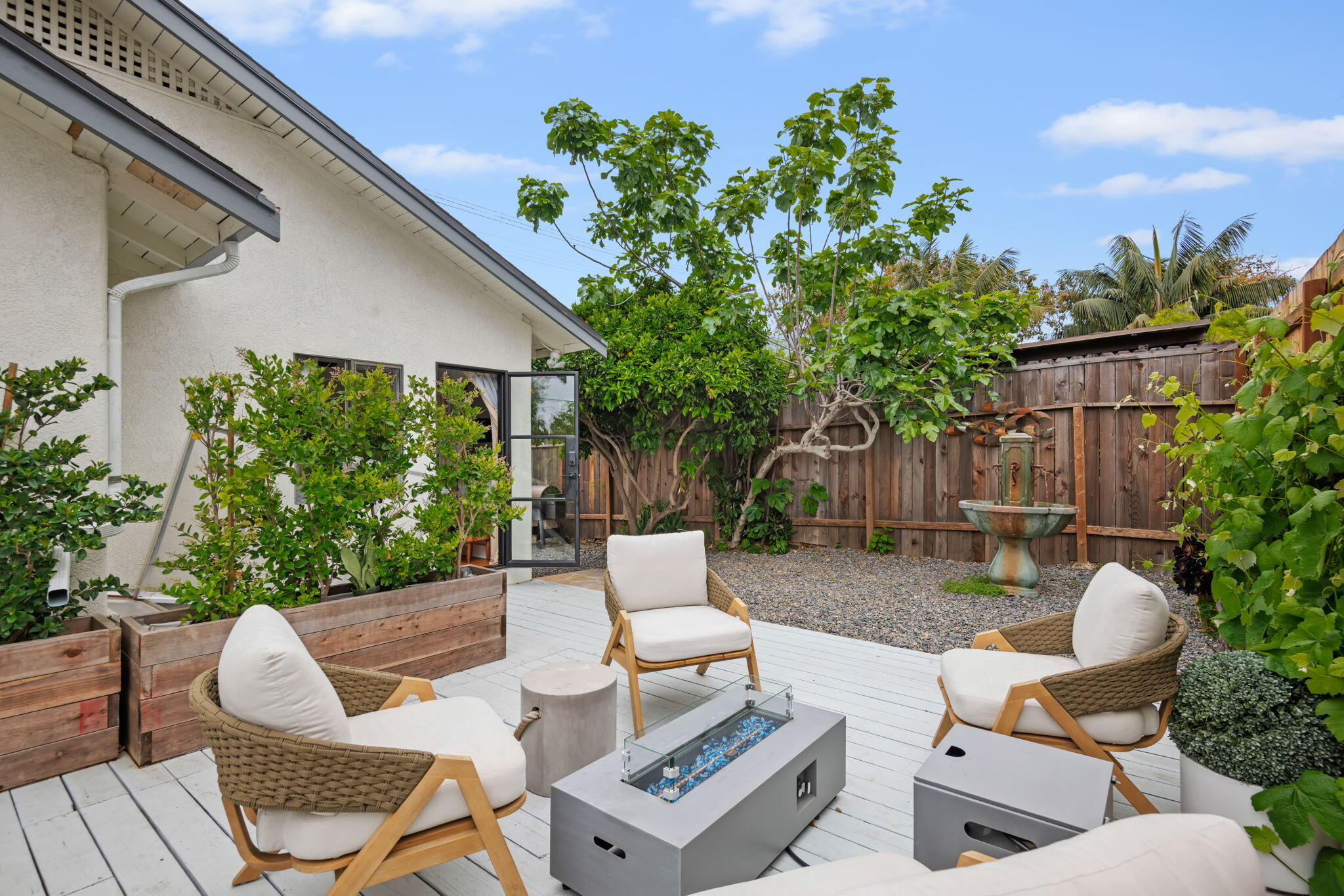 802 Olive Street Santa Barbara, CA 93101 - Photo 23 of 26 a view of backyard of house with seating space