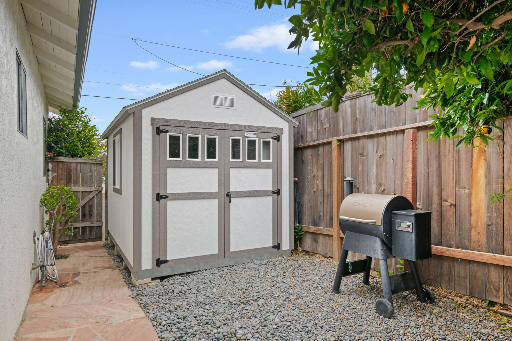 802 Olive Street Santa Barbara, CA 93101 - Photo 25 of 26 a front view of a house with garden and sitting area