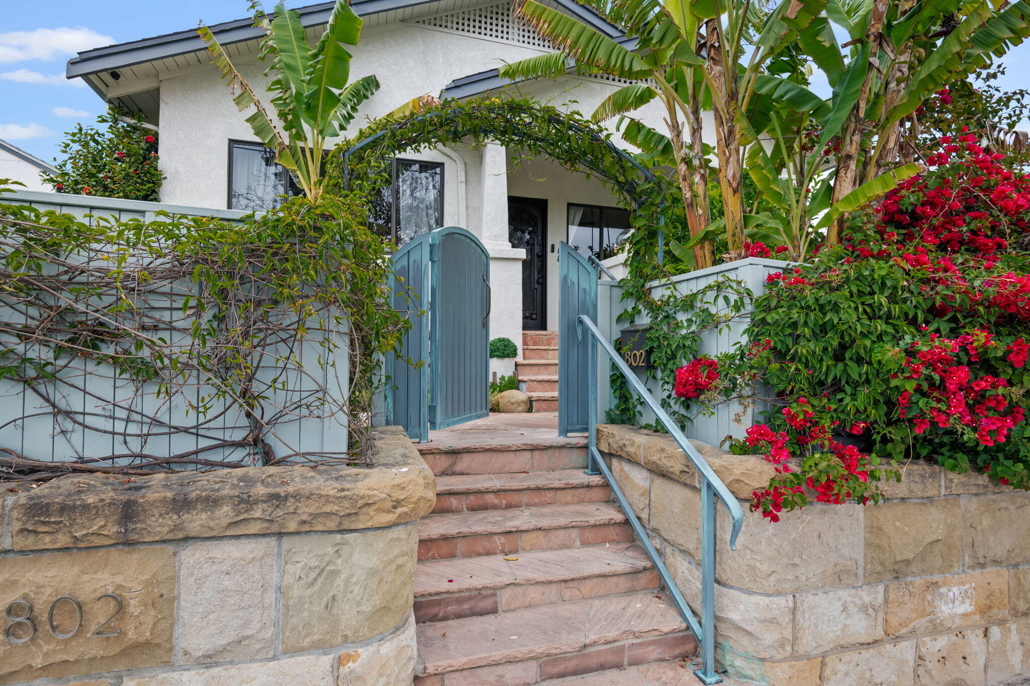 802 Olive Street Santa Barbara, CA 93101 - Photo 3 of 26 a front view of a house with a yard