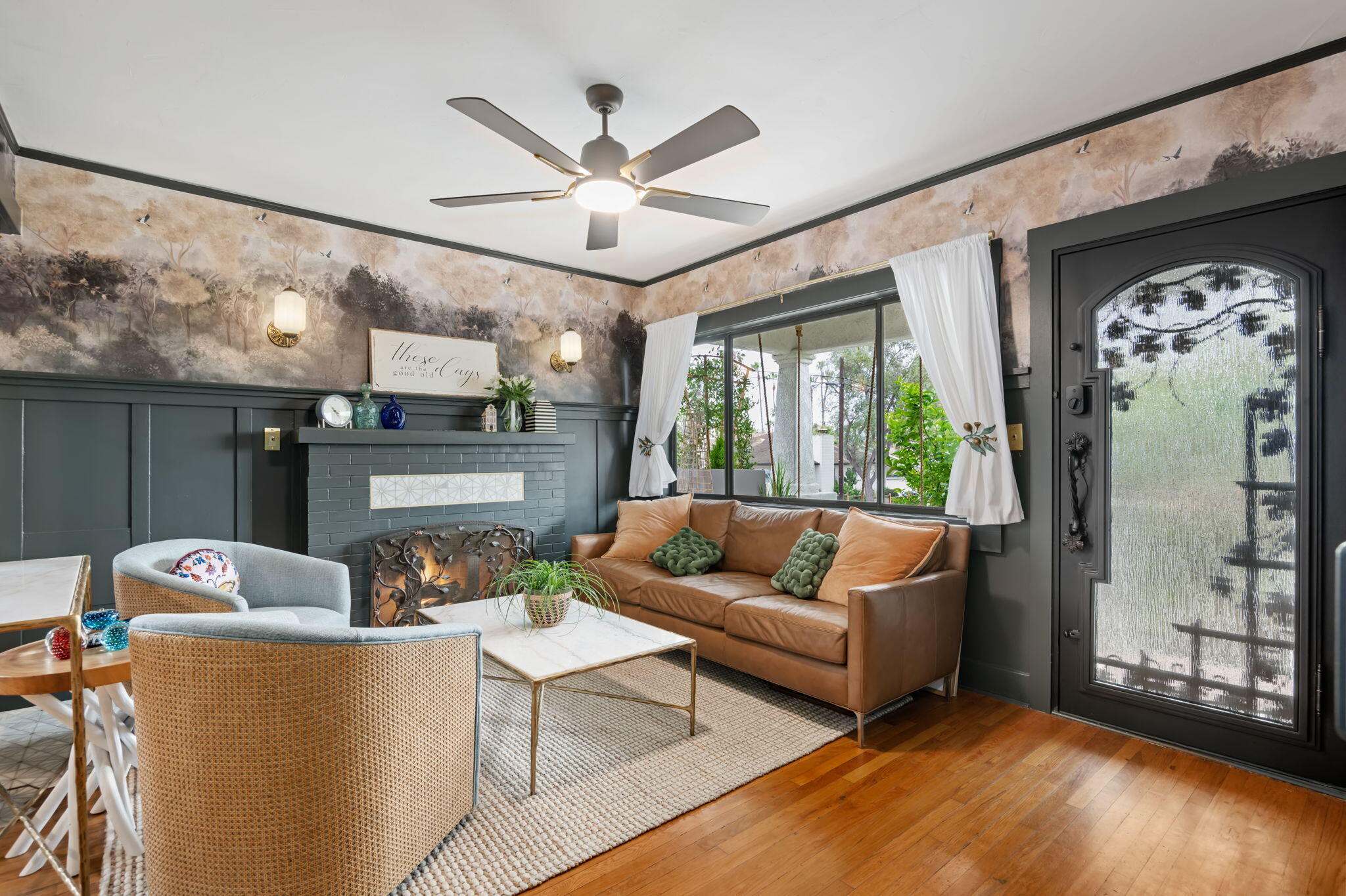 802 Olive Street Santa Barbara, CA 93101 - Photo 9 of 26 a living room with furniture a ceiling fan and a large window