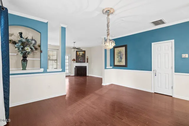 a kitchen with stainless steel appliances granite countertop a sink a stove a microwave a refrigerator a center island and cabinets