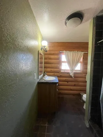 a bedroom with a bed and a mirror