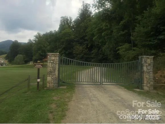 a front view of a residential apartment building with a yard