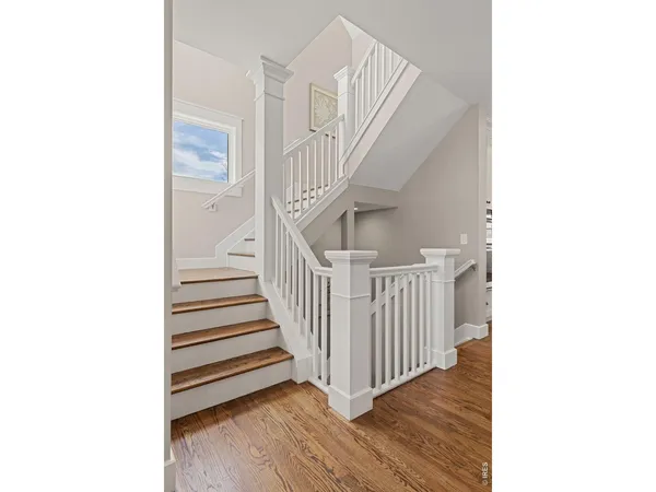 a view of a hallway with stairs