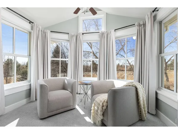 a living room with furniture and windows