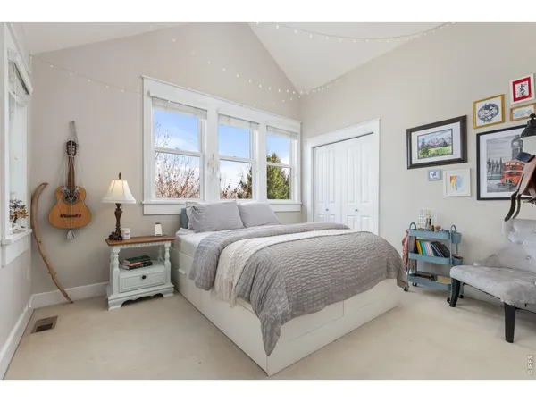 a bedroom with a bed and a couch