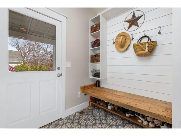 a bench sitting in front of a door