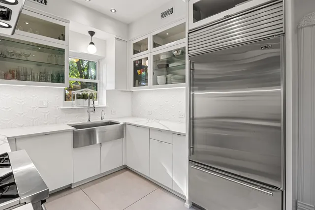 a kitchen with a sink and cabinets