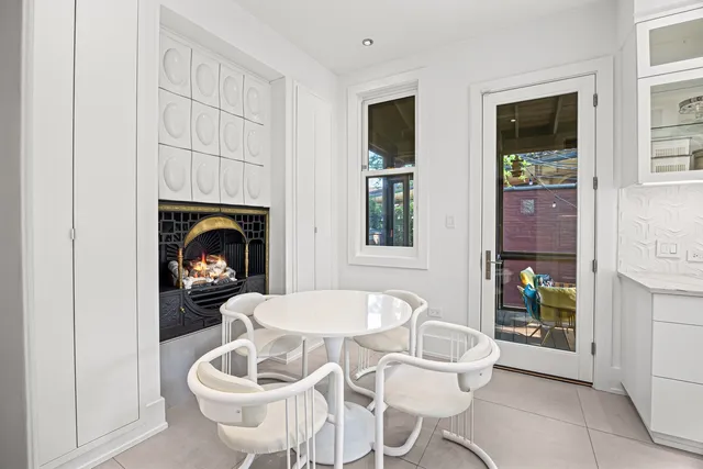 a living room with furniture a fireplace and table