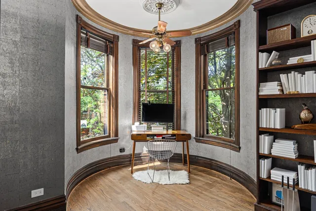 a workspace with furniture and a window