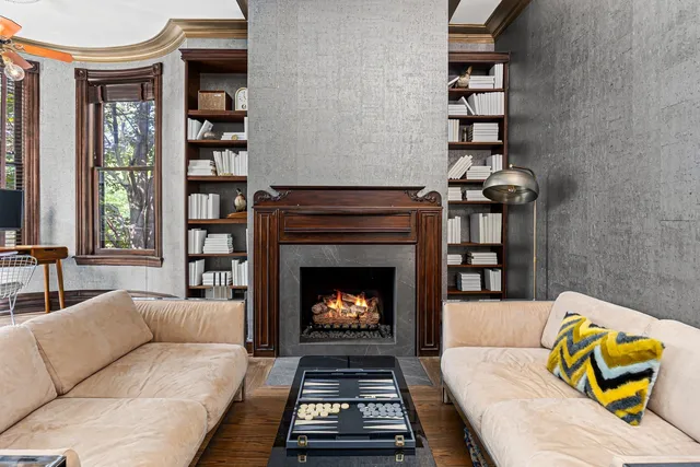 a living room with furniture and a fireplace