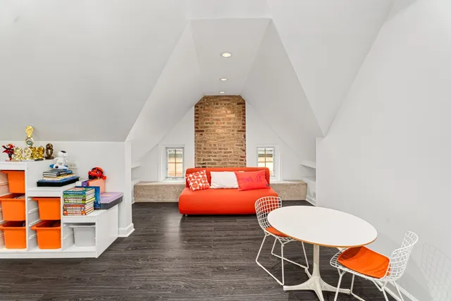 a bedroom with furniture and a chair