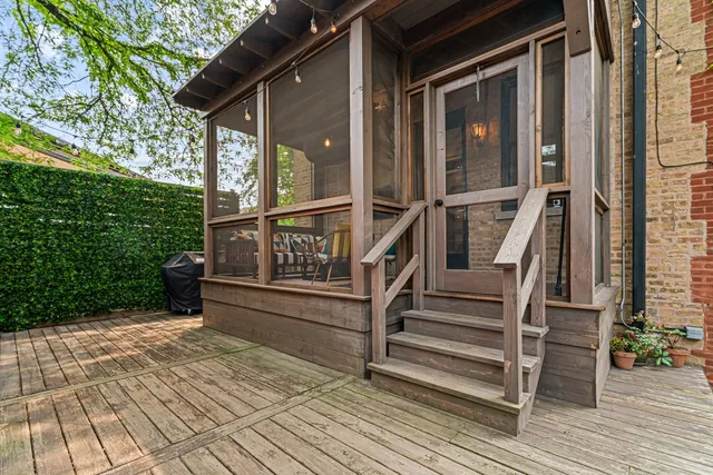 a view of a chairs and table in the balcony
