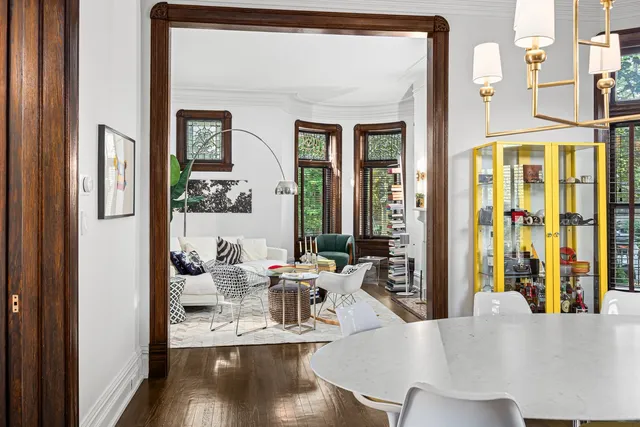 a view of a dining room with tables and chairs