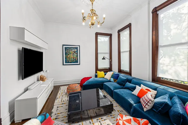 a bedroom with furniture and a flat screen tv