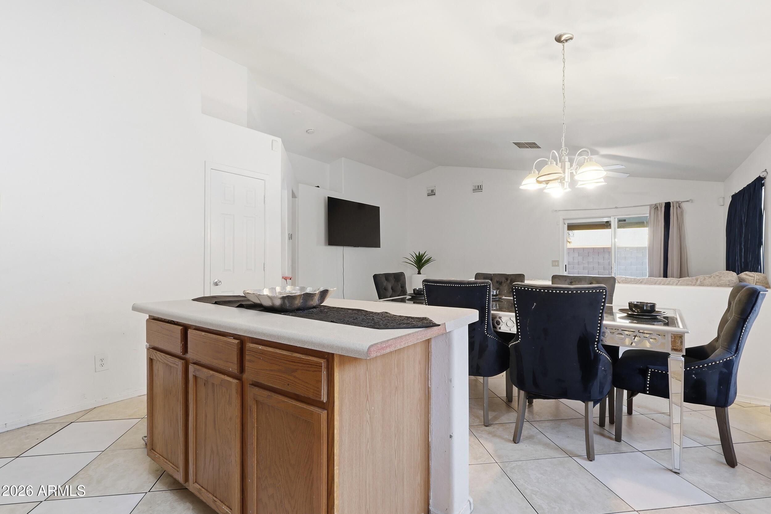 11964 West Granada Road Avondale, AZ 85392 - Photo 13 of 36 a view of a dining room with furniture