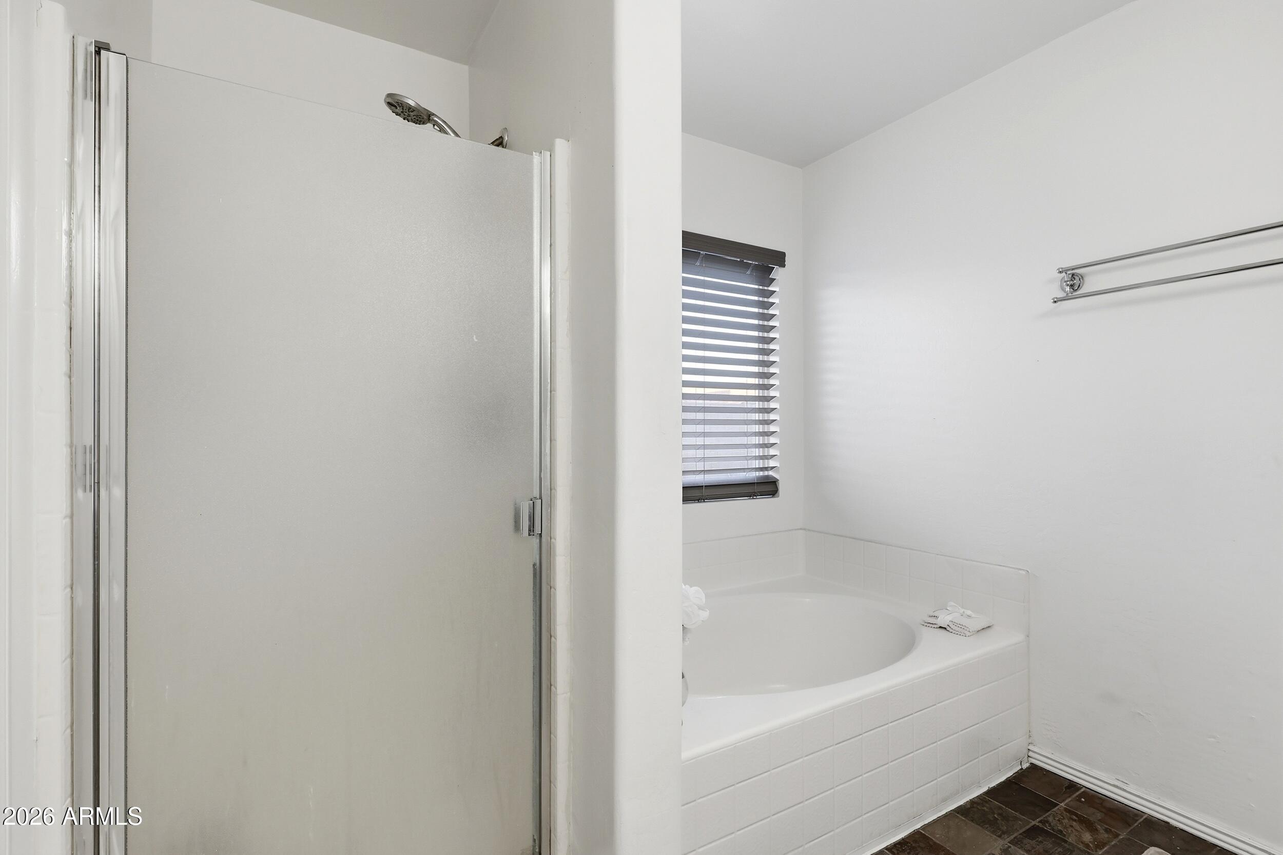 11964 West Granada Road Avondale, AZ 85392 - Photo 22 of 36 a bathroom with a bathtub