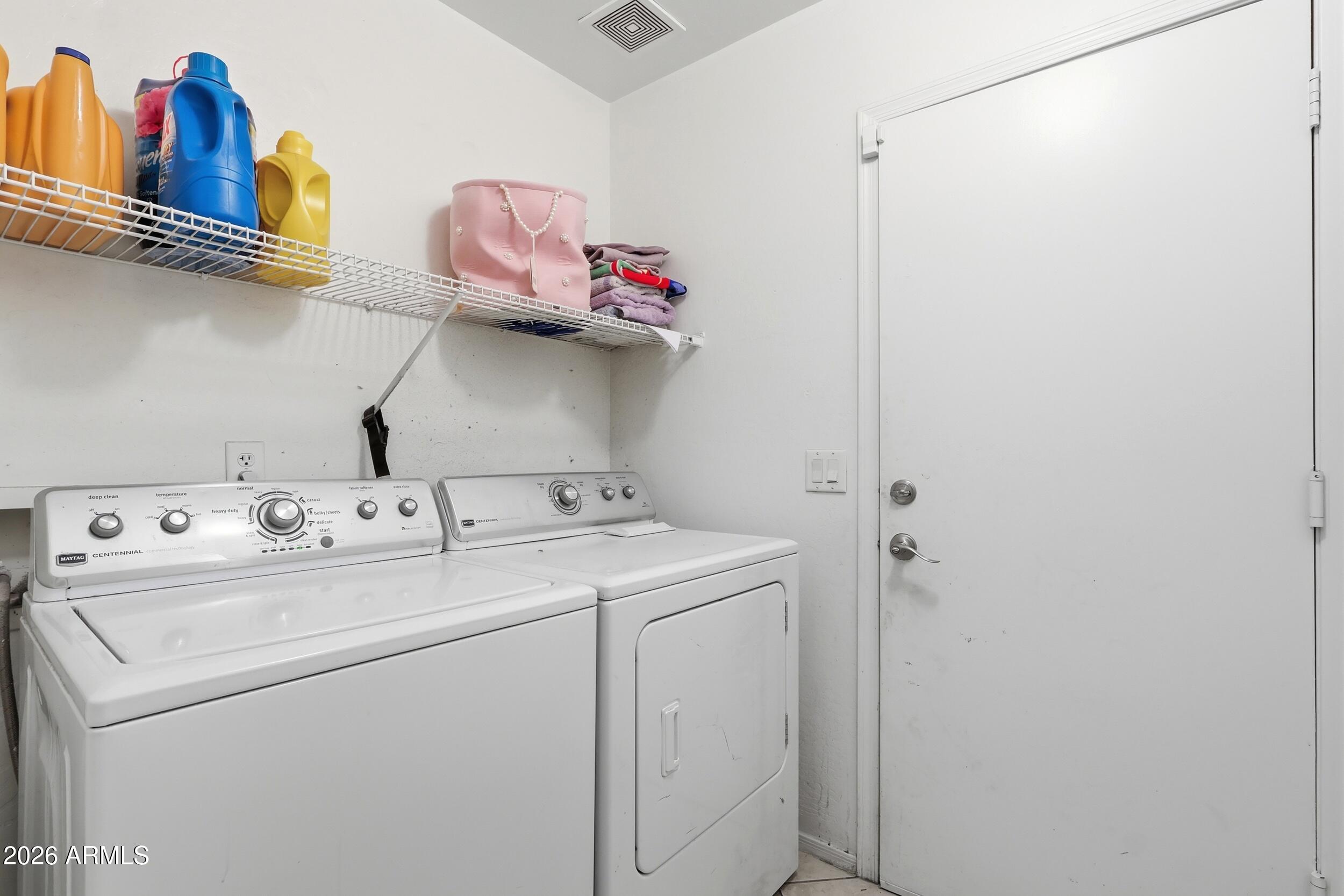 11964 West Granada Road Avondale, AZ 85392 - Photo 28 of 36 a utility room with dryer and washer