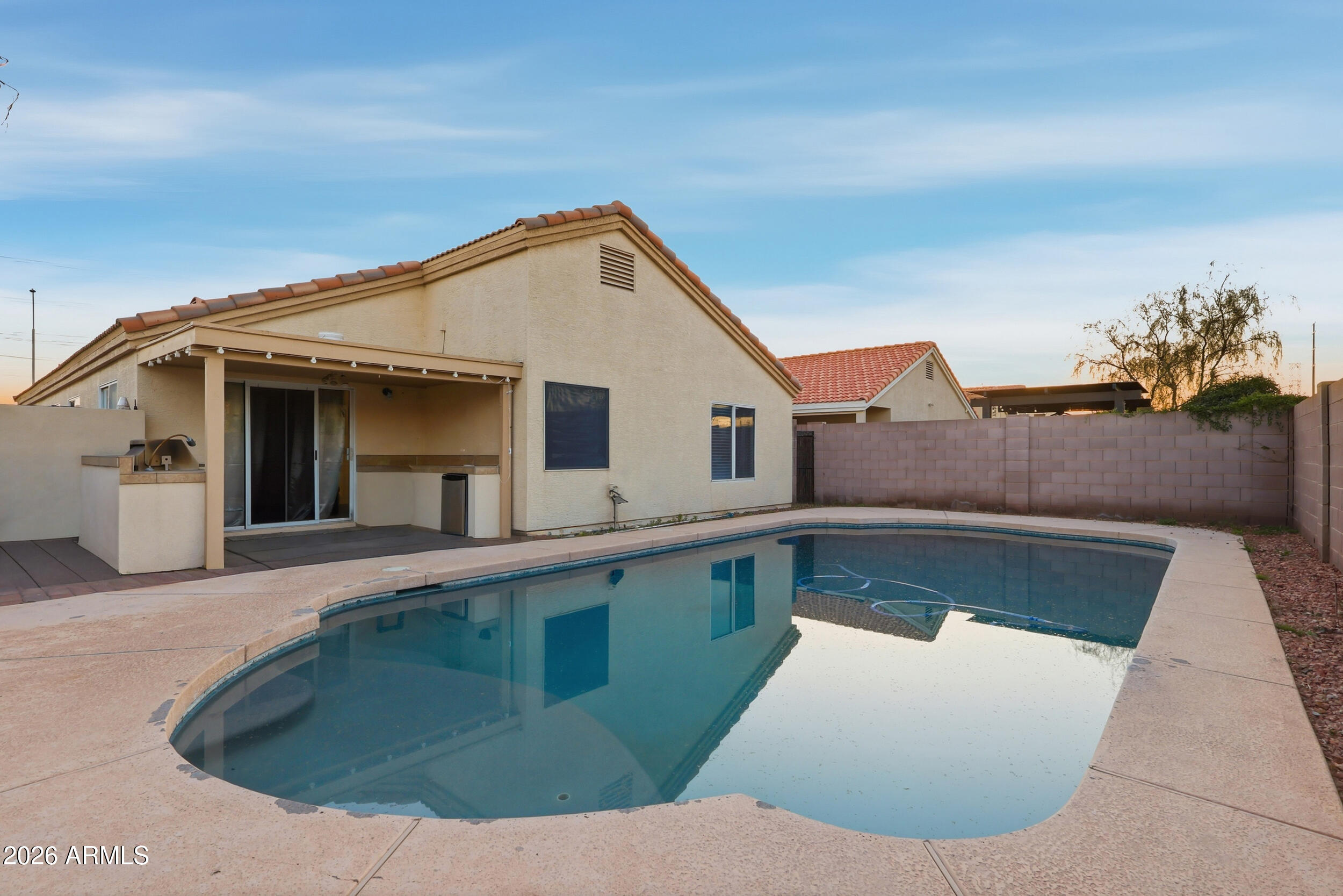 11964 West Granada Road Avondale, AZ 85392 - Photo 30 of 36 a view of a house with pool