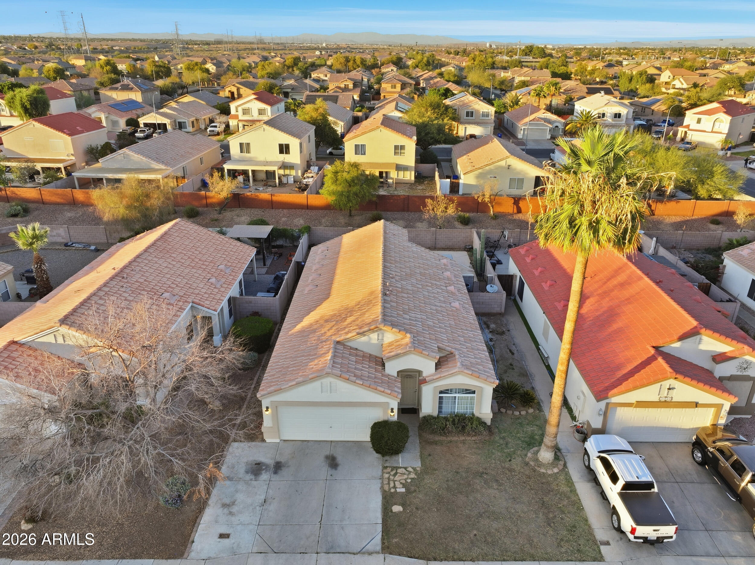11964 West Granada Road Avondale, AZ 85392 - Photo 4 of 36 an aerial view of residential houses with outdoor space